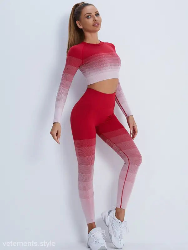Woman in red ombre workout set with white sneakers, highlighting purple long sleeve and orange pink pants