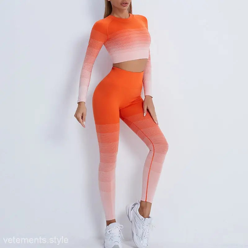 Ombre orange and pink workout set with long-sleeved purple long sleeve and white sneakers