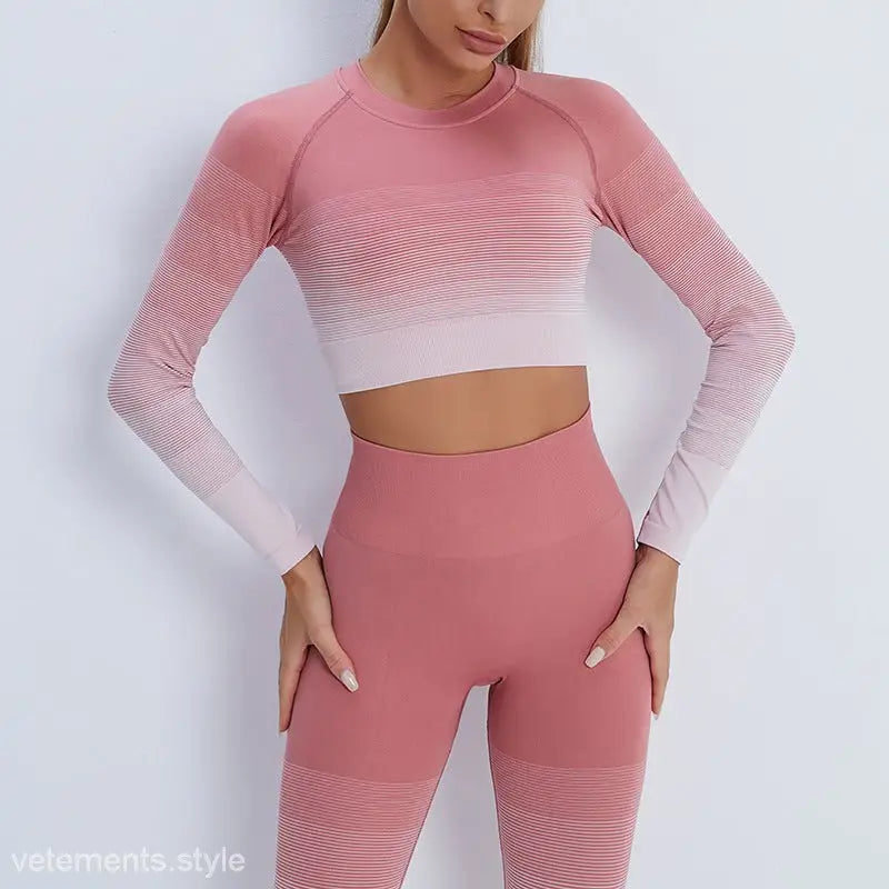 Pink ombré workout set with long sleeve crop top and high-waisted leggings for active wear