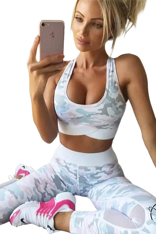 Blonde woman in sporty slim camo sleeveless yoga exercise suit