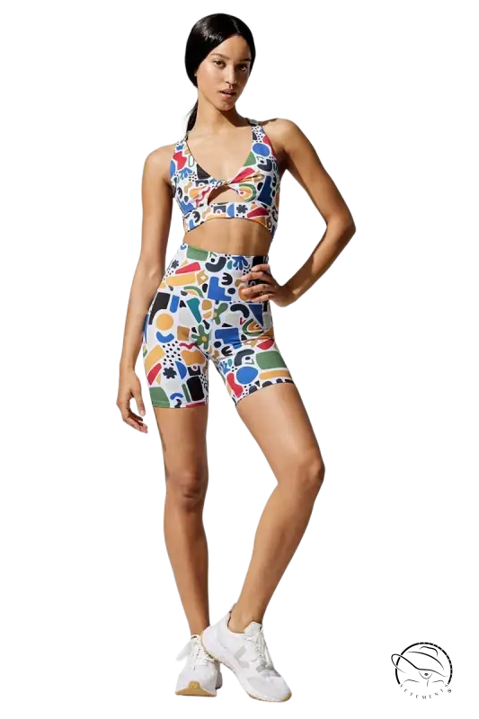 Woman in colorful letter graphic fitness printing elastic suit with sneakers