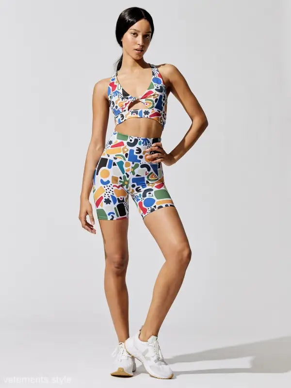 Woman in colorful crop top and shorts set from the Printing Elastic Fitness Graphic Suit
