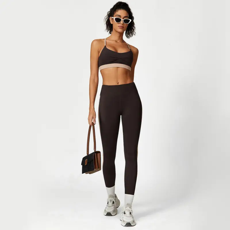 Woman in athletic wear showcasing the Sporty Slim Nylon Color Block Cutout Set for Waist Hip Lift