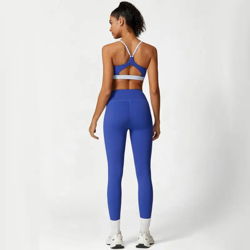 Blue athletic set showcasing the Sporty Slim Nylon Color Block Cutout Set for Waist Hip Lift