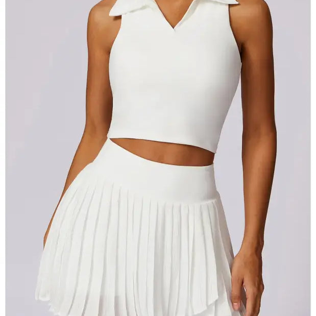 White sleeveless crop top and pleated mini skirt set in Swan White Suit for stylish looks