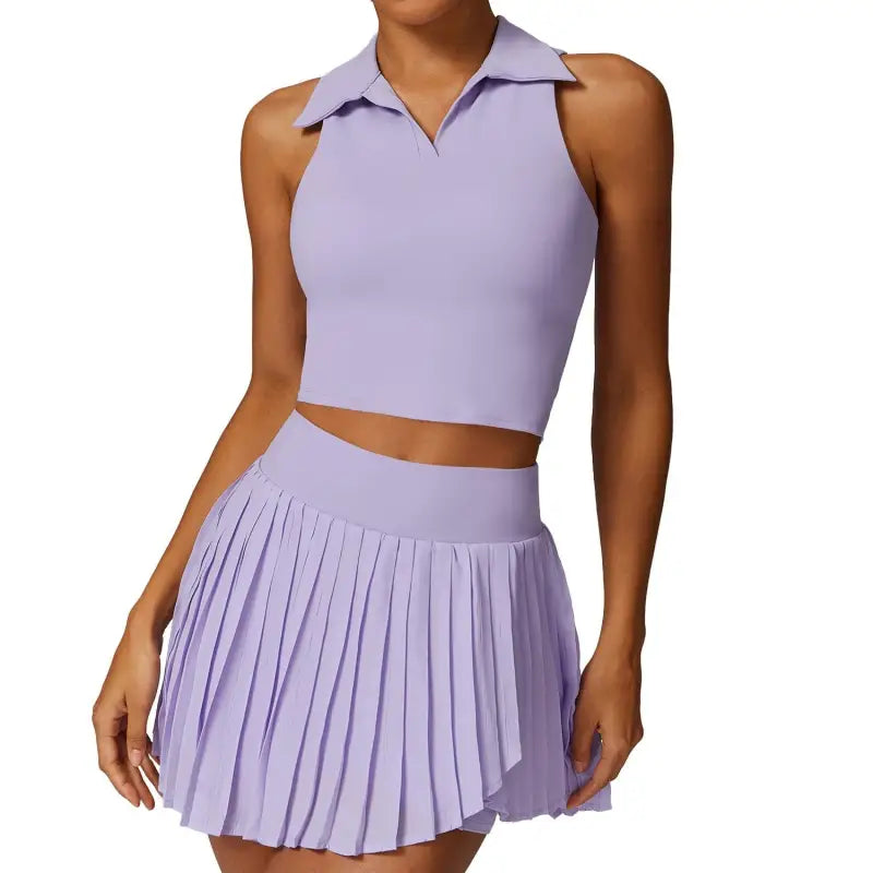 Lavender two-piece outfit featuring a sleeveless crop top and pleated mini skirt in Swan White Suit