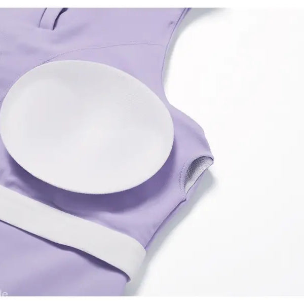 White circular nursing pad on light purple fabric with Sporty Slim Nylon High Rise Bottom in Swan White Suit