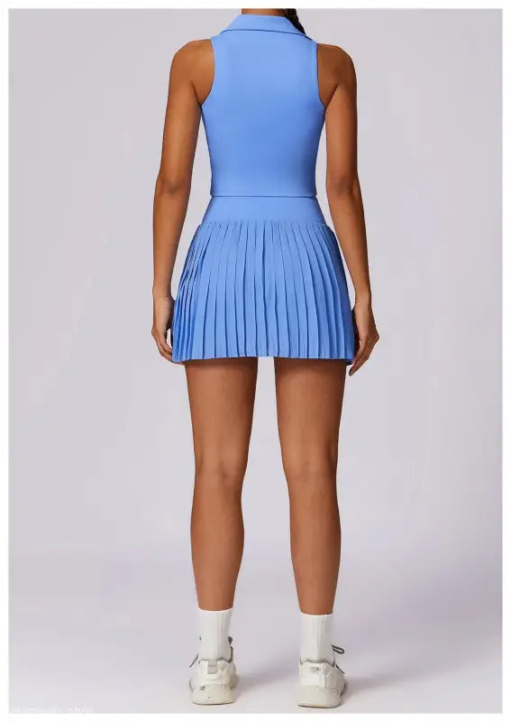 Light blue sleeveless tennis dress with pleated skirt for Swan White Suit collection