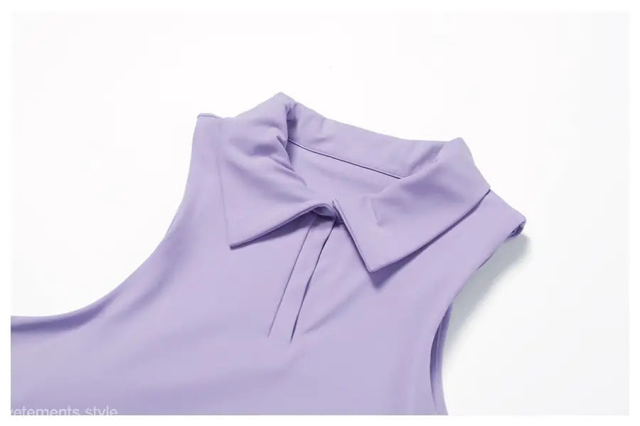 Sleeveless lavender blouse with collar paired with Swan White Suit for a romantic look