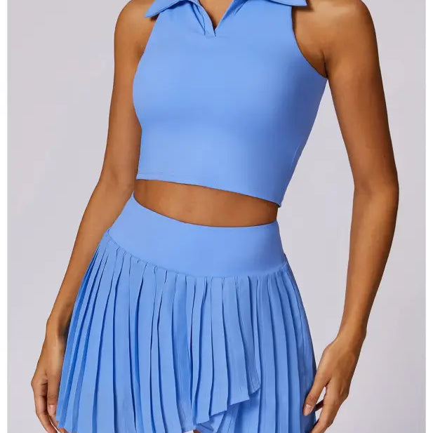 Light blue two-piece outfit featuring a sleeveless crop top and pleated mini skirt in Swan White Suit