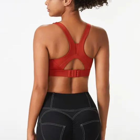 Woman wearing Sporty Spandex Sports Bra with integrated mold cup and cutout back