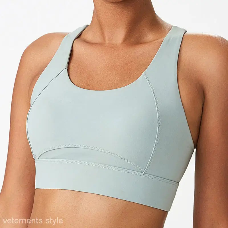 Light blue sports bra with integrated mold cup and cutout back for active wear