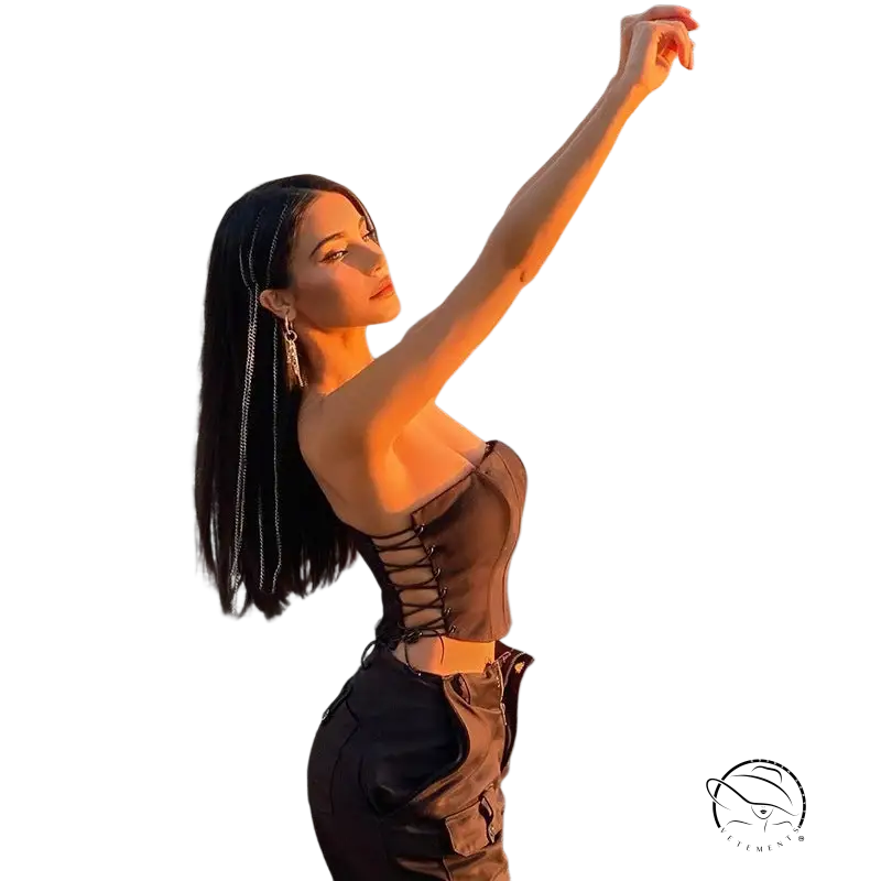 Woman in strap boning corset top with lace-up detail and cargo pants