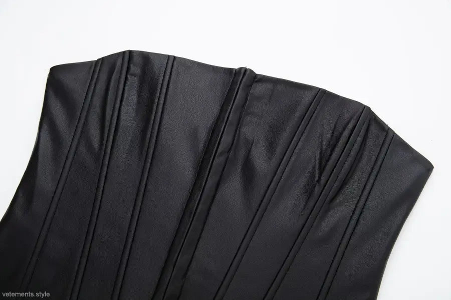 Black strapless faux leather corset with vertical seams and pleating for summer style