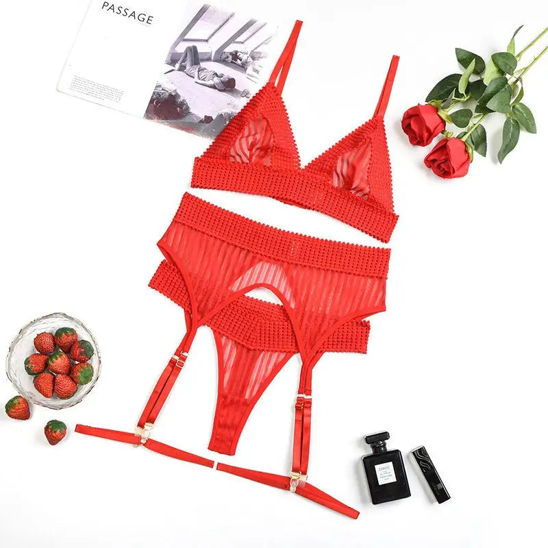Strawberry red lace lingerie set with sheer mesh bra, thong, and garter belt