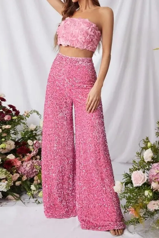 Image of stunning pinky suits featuring a high waist slimming strapless crop top and wide-leg pants suitable for summer elegance