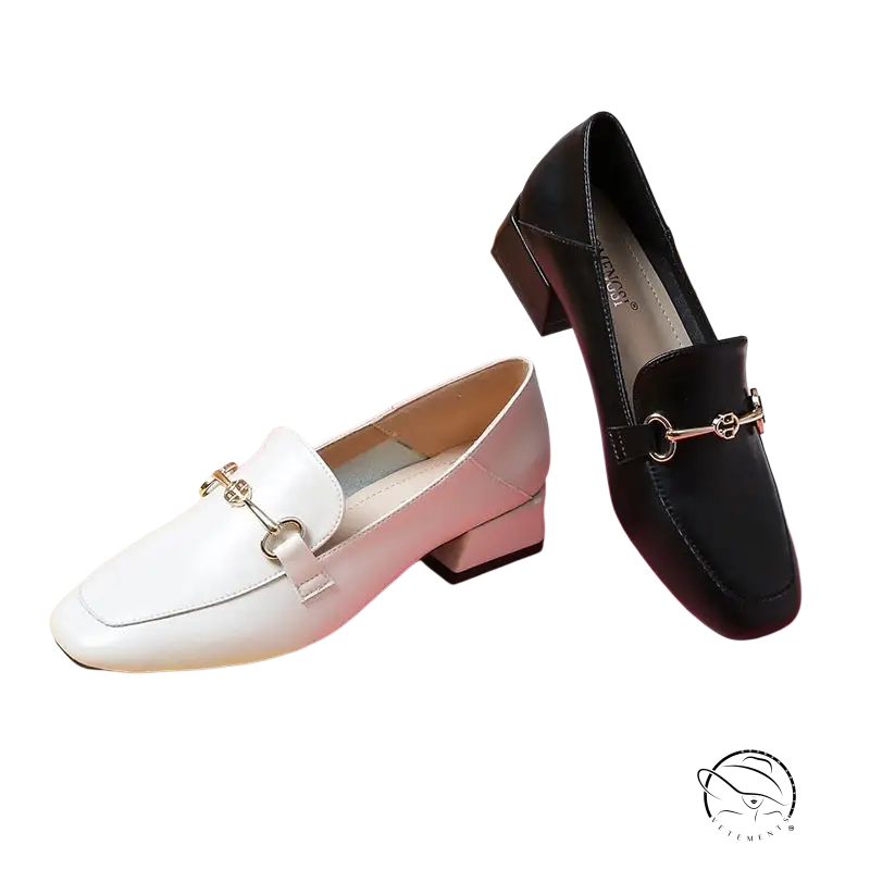 Pair of contrasting black and white British leather shoes female loafers