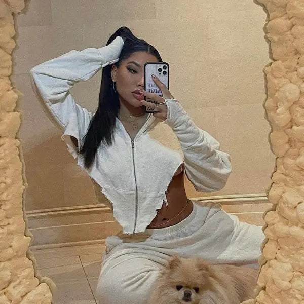 Woman in white cropped hoodie with dog in casual sportswear for the sexy sweet girl