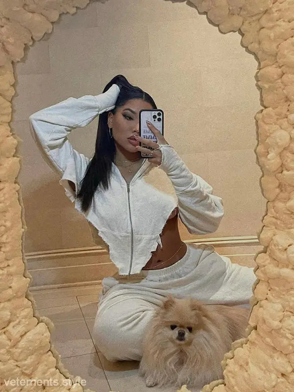 Woman in white cropped hoodie with dog in casual sportswear for the sexy sweet girl