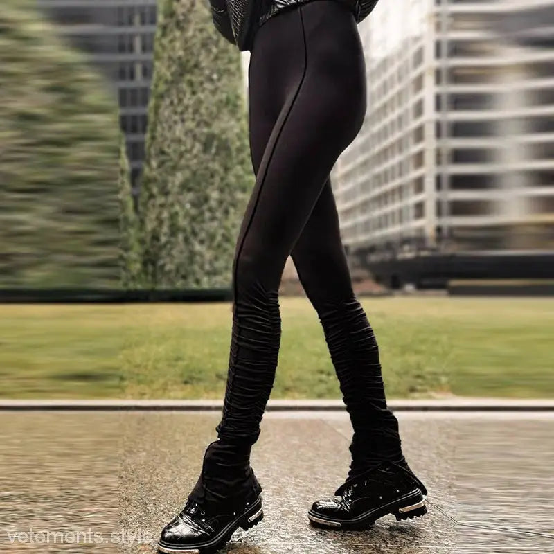 Black high waist slim fit seasonless leggings with ruched design and patent leather boots