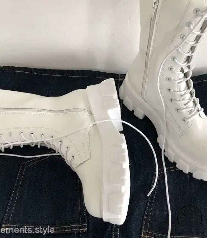 Stylish lace-up platform boots with white chunky soles