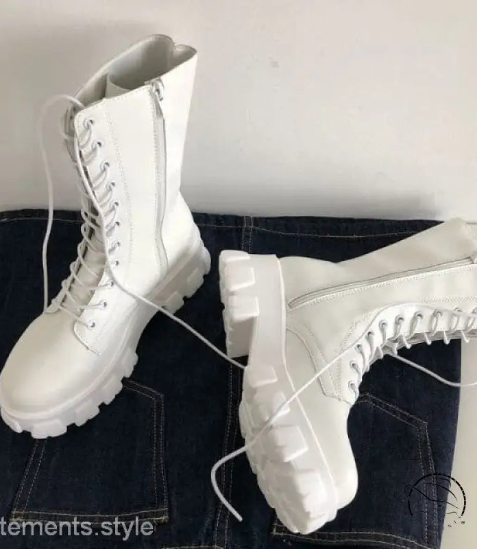 Stylish lace-up platform boots in white with chunky soles and side zippers