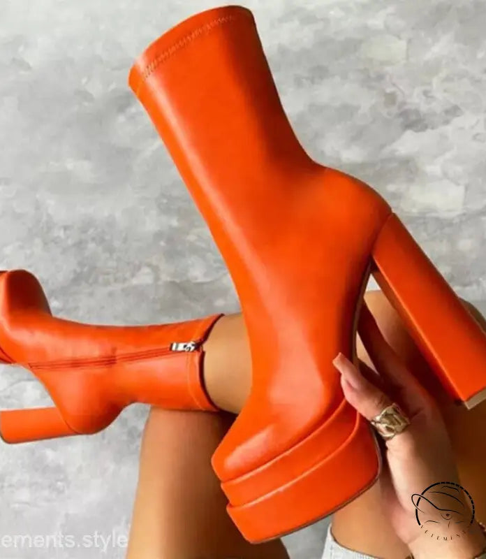 Bright orange stylish mid calf platform heeled boot with knee-high shaft