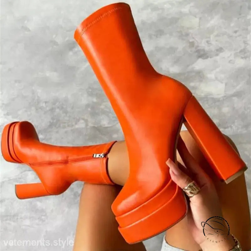 Bright orange stylish mid calf platform heeled boot with knee-high shaft