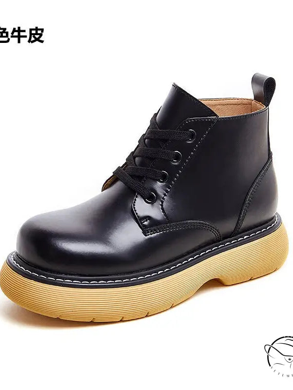 Stylish thick-sole leather boots in black with yellow sole and lace-up front