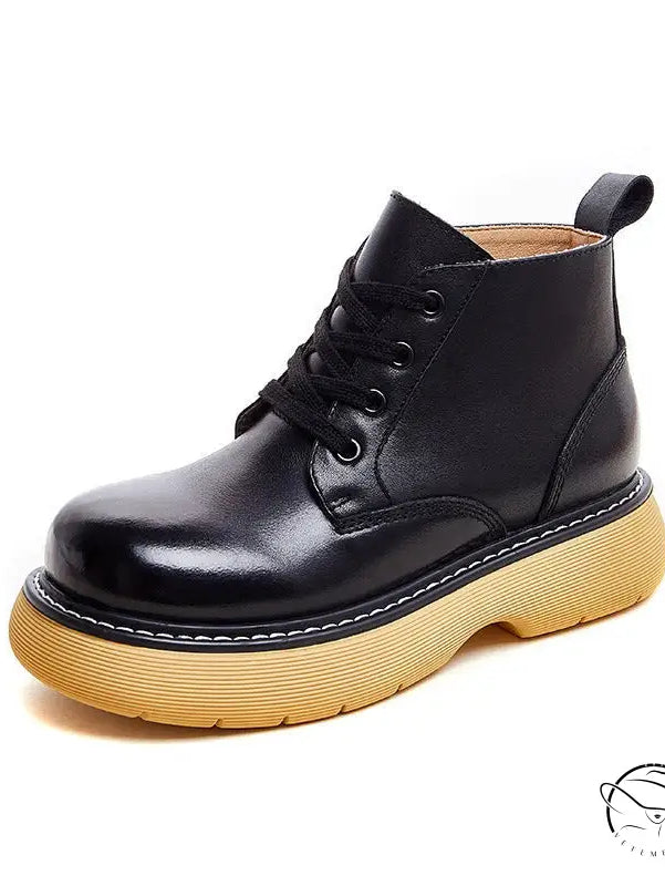 Stylish thick-sole leather boots in black with chunky yellow sole