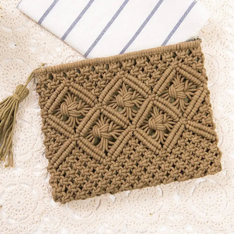 Tan macramé clutch with diamond pattern and tassel, perfect for bohemian beach bag styling