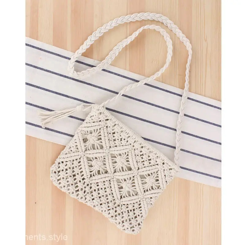 Cream-colored macramé handbag with braided handles for the Bohemian Beach Bag