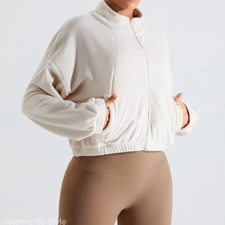 Beige fleece sports jacket featuring temperament pink accents, ideal for fall/winter outerwear