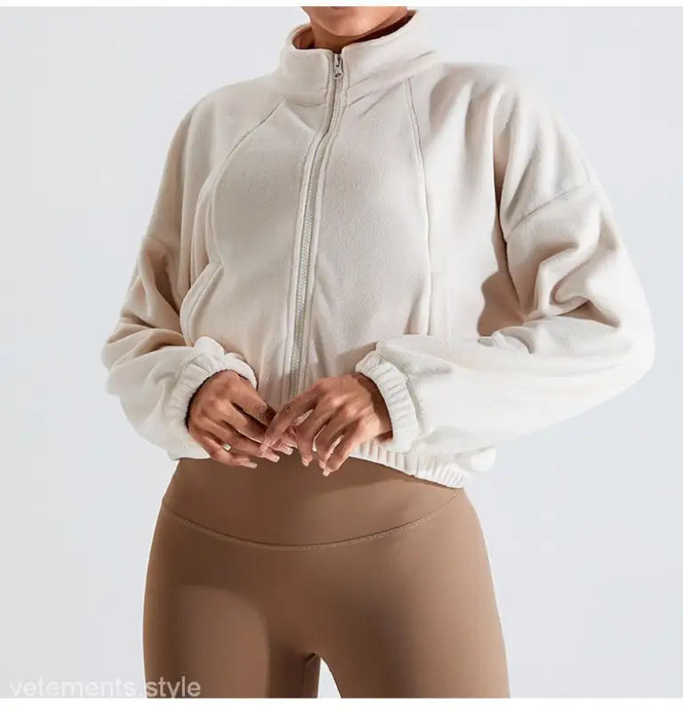 Beige fleece sports jacket featuring temperament pink accents and kaki brown details