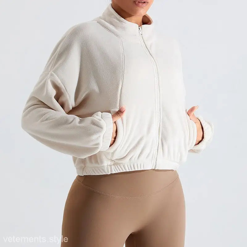 Cream-colored fleece sports jacket in Temperament Pink with kaki brown accents for fall/winter