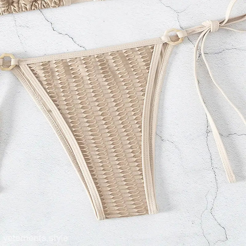 Beige textured bikini bottom from the Textured Solid Tie Strap Halter Lacing Bikini