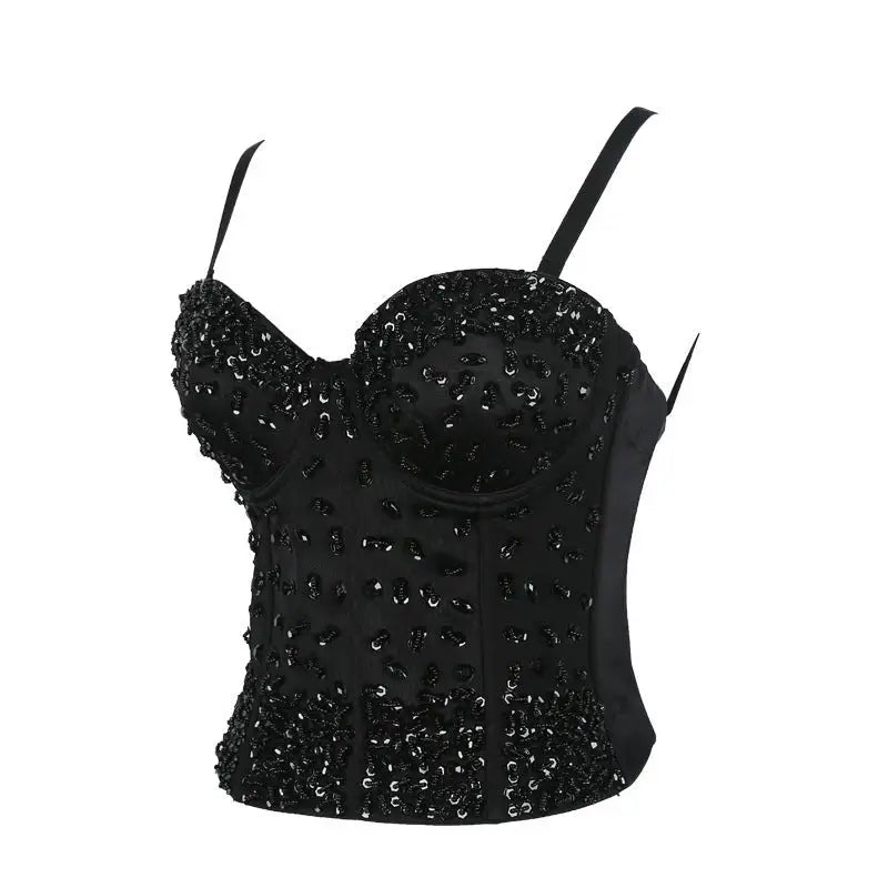 Three dimensional corset top in black sequins on black background