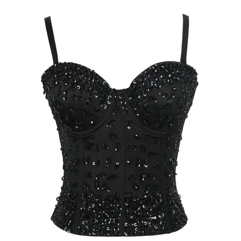 Three dimensional black sequined corset top on black background