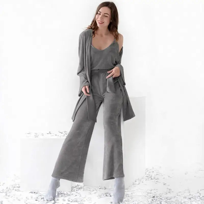 Woman in gray three-piece knitted winter pajamas set for spring and fall comfort