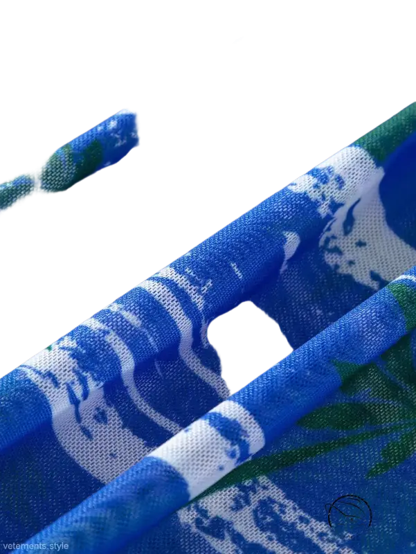 Three piece long sleeve swimsuit in blue white fabric with green leaf designs