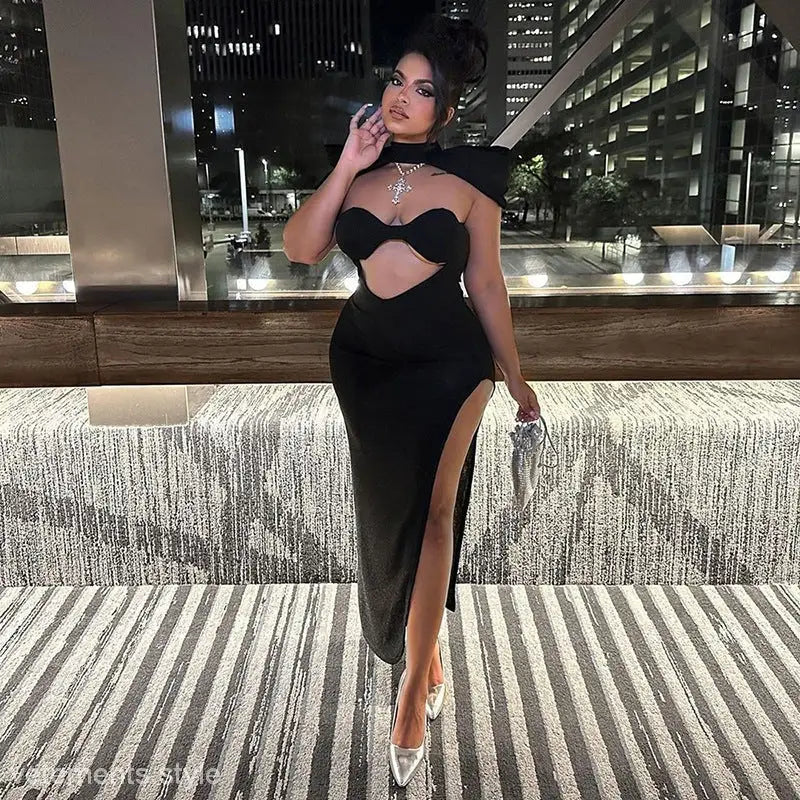 Woman wearing trendy open bone dress in black asymmetric cutout bodycon midi style
