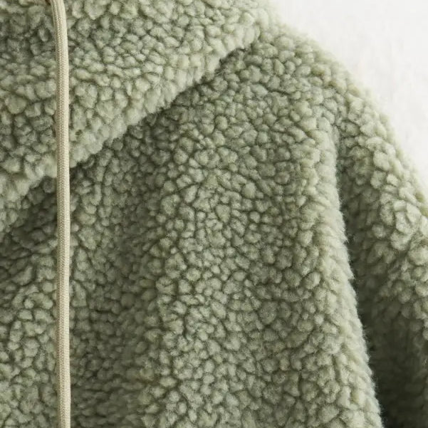 Pale green Urban Hooded Wool Coat featuring zipper closure and pockets for winter