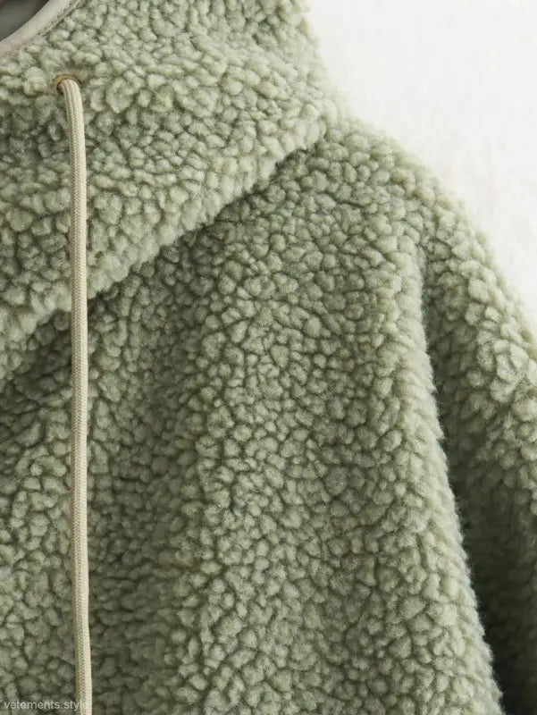 Pale green Urban Hooded Wool Coat featuring zipper closure and pockets for winter