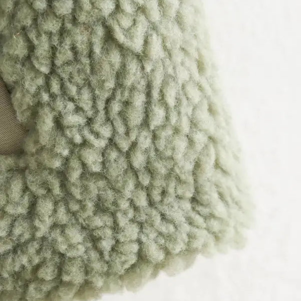 Fluffy, pale green wool texture of the Urban Hooded Wool Coat for winter