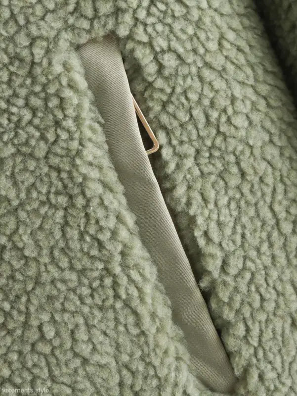 Pocket detail on light green fleece of Urban Hooded Wool Coat for winter wear