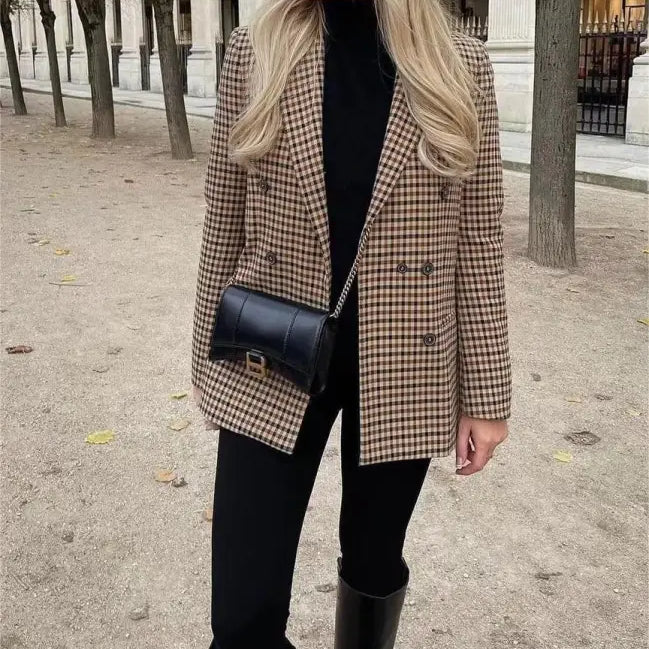 Woman wearing a vintage single breasted plaid blazer outfit for Spring and Fall