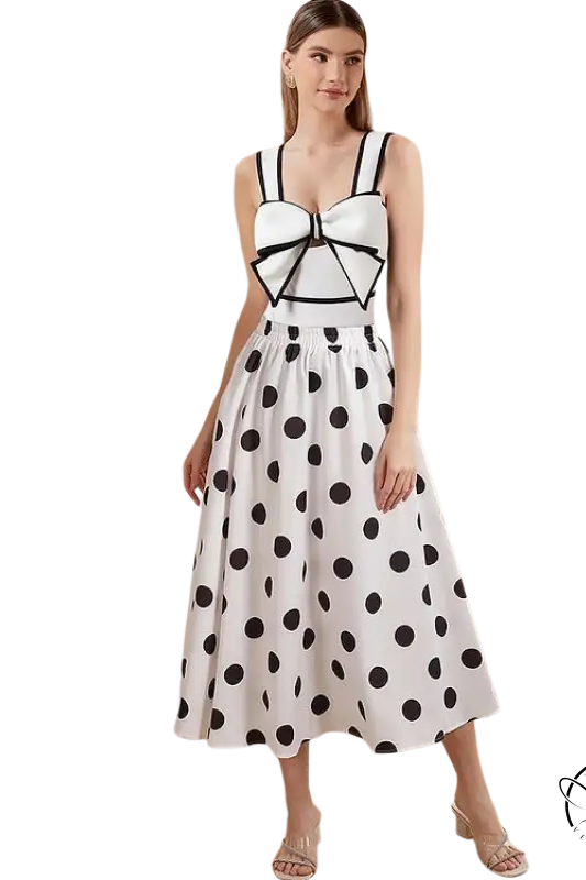 Woman in polka dot dress wearing white swimsuit chiffon beach skirt set