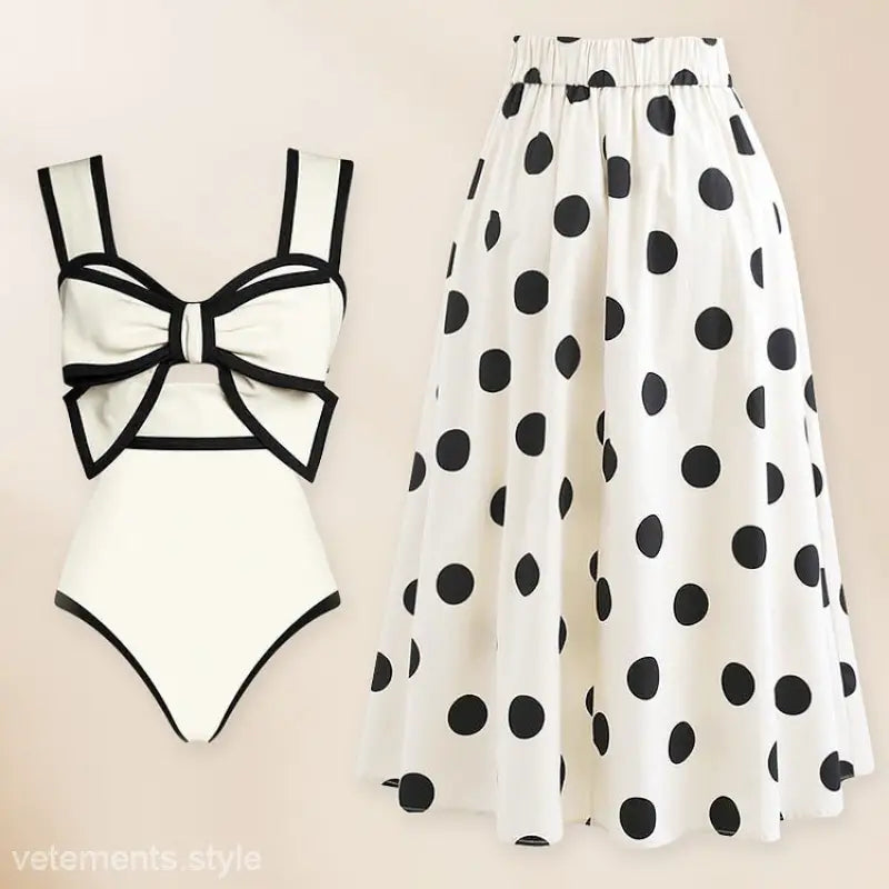 White swimsuit and chiffon beach skirt set with bow detail, perfect for stylish beach outings