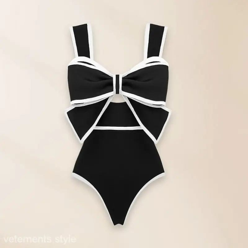 Black and white bow-adorned white swimsuit in a chiffon beach skirt set for stylish outings