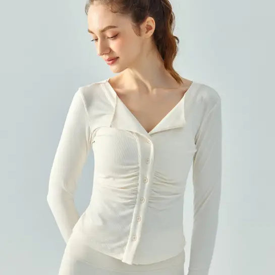 Woman in a white button-up top showcasing the Wild Rose Yoga Breathable Fit in Milk Tea White